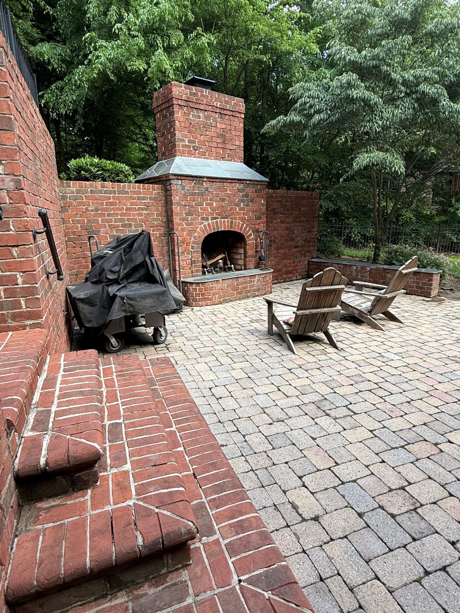 Paver patio and brick fireplace after pressure washing